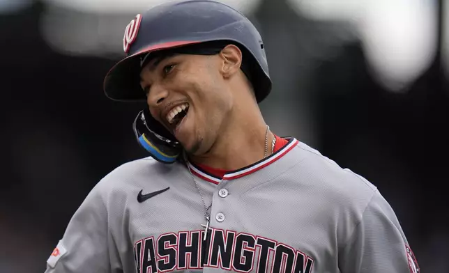 Washington Nationals' Daylen Lile (51) celebrates after hitting a home run during the fourth inning of a baseball game against the Chicago Cubs, Saturday, Sept. 6, 2025, in Chicago. (AP Photo/Erin Hooley)