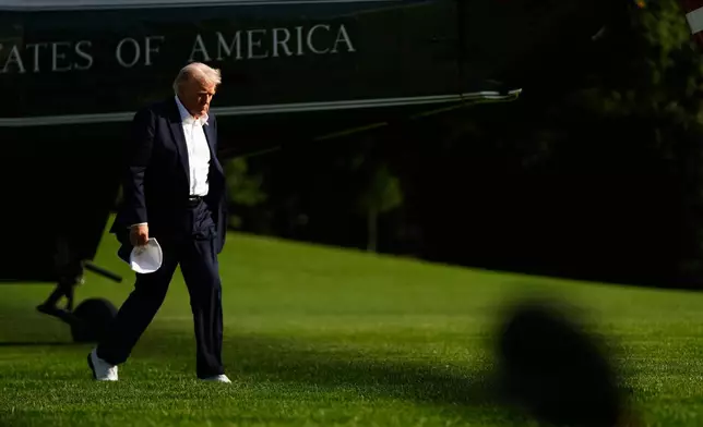 President Donald Trump arrives at the White House, Friday, Sept. 26, 2025, in Washington. (AP Photo/Julia Demaree Nikhinson)