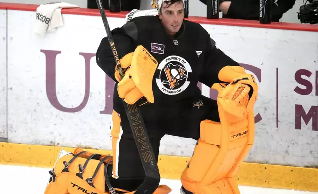 Pittsburgh Penguins goalie Marc-Andre Fleury waits his turn in net during the NHL hockey team's pre-game skate in Cranberry Township, Pa., Friday, Sept. 26, 2025. (AP Photo/Gene J. Puskar)