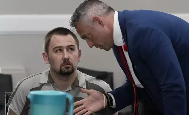 Defendant Austin Drummond, left, accused of quadruple murder, speaks to his attorney Jere Mason, right, as he appears in court during a preliminary hearing, Thursday, Sept. 4, 2025, in Tiptonville, Tenn. (AP Photo/George Walker IV, Pool)