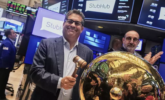 StubHub CEO Eric Baker rings a ceremonial bell as his company stock begins trading, on the floor of the New York Stock Exchange, Wednesday, Sept. 17, 2025. (AP Photo/Richard Drew)