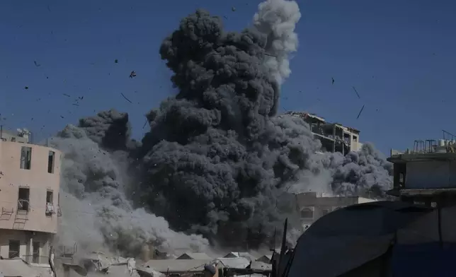 Smoke rises following an Israeli military strike on a building in Gaza City, Friday, Sept. 12, 2025. (AP Photo/Yousef Al Zanoun)