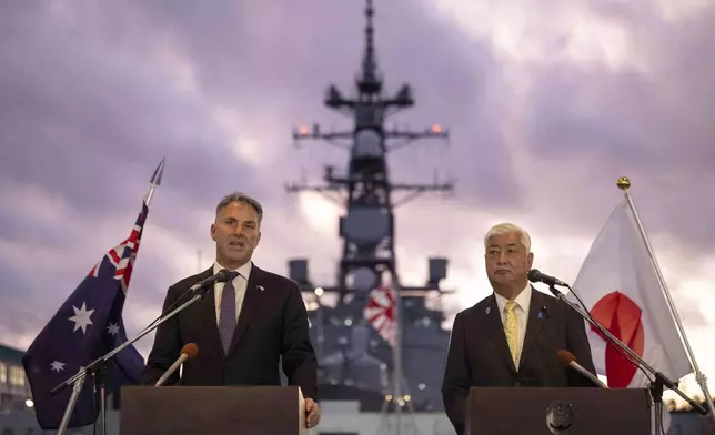 Japan's Defence Minister Gen Nakatani, right, and Australia's Defence Minister Richard Marles hold a joint press announcement aboard the Japan Maritime Self-Defense Force (JMSDF) Mogami-class stealth frigate JS Mikuma at the JMSDF naval base in Yokosuka, Japan, Friday Sept. 5, 2025. (Yuichi Yamazaki/Pool Photo via AP)