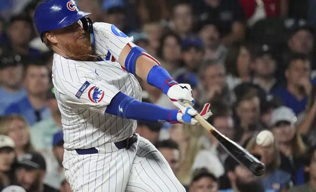 Chicago Cubs' Justin Turner hits a single during the third inning of a baseball game against the Atlanta Braves in Chicago, Tuesday, Sept. 2, 2025. (AP Photo/Nam Y. Huh)