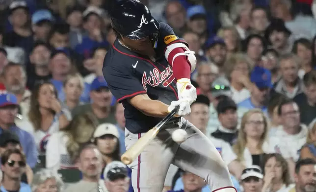 Atlanta Braves' Ha-Seong Kim, of South Korea, hits a single during the seventh inning of a baseball game against the Chicago Cubs in Chicago, Tuesday, Sept. 2, 2025. (AP Photo/Nam Y. Huh)