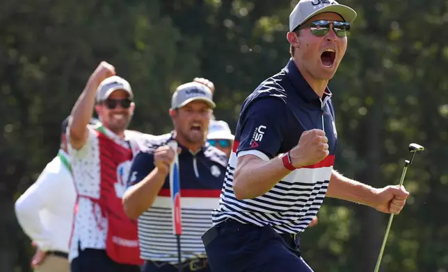United States' Bryson DeChambeau celebrates after a birdie with Ben Griffin on the sixth hole at Bethpage Black golf course during the Ryder Cup golf tournament, Friday, Sept. 26, 2025, in Farmingdale, N.Y. (AP Photo/Lindsey Wasson)