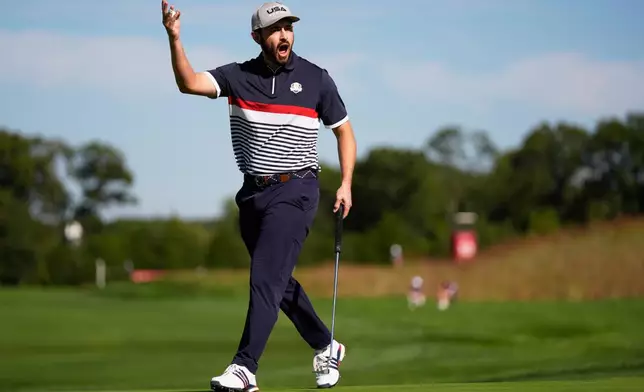 United States' Patrick Cantlay celebrates after a putt on the 11th hole at Bethpage Black golf course during the Ryder Cup golf tournament, Friday, Sept. 26, 2025, in Farmingdale, N.Y. (AP Photo/Robert Bukaty)