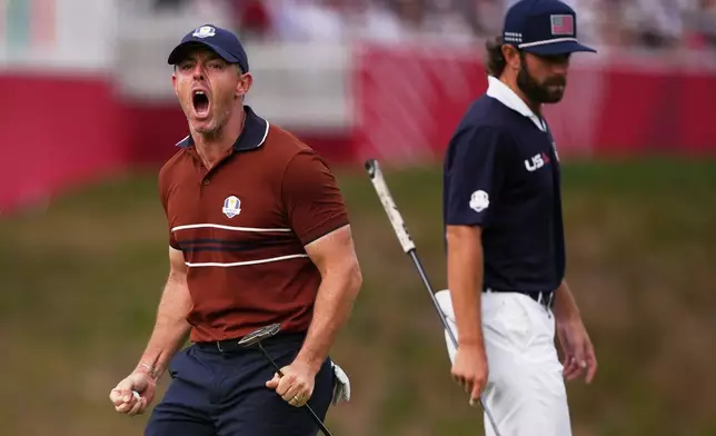 Europe's Rory McIlroy celebrates after a putt on the 14th hole at Bethpage Black golf course during the Ryder Cup golf tournament, Saturday, Sept. 27, 2025, in Farmingdale, N.Y. (AP Photo/Matt Slocum)