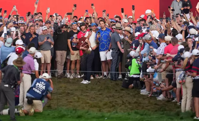 Europe's Tommy Fleetwood hits from the rough on the first hole at Bethpage Black golf course during the Ryder Cup golf tournament, Saturday, Sept. 27, 2025, in Farmingdale, N.Y. (AP Photo/Lindsey Wasson)