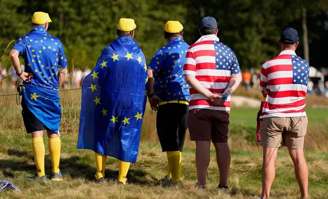 Fans watch at Bethpage Black golf course during the Ryder Cup golf tournament, Friday, Sept. 26, 2025, in Farmingdale, N.Y. (AP Photo/Seth Wenig)