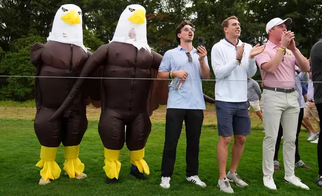Fans watch on the 10th hole at Bethpage Black golf course during the Ryder Cup golf tournament, Friday, Sept. 26, 2025, in Farmingdale, N.Y. (AP Photo/Lindsey Wasson)