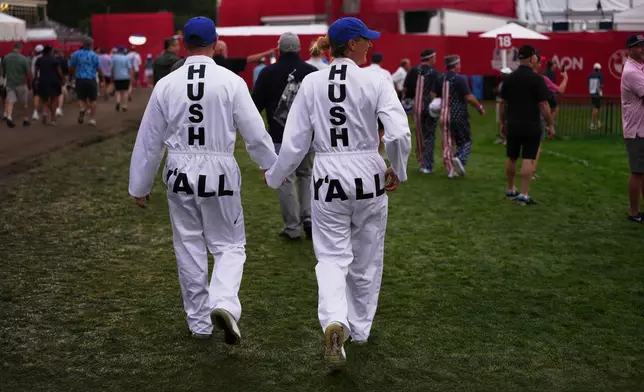 Fans walk on the first hole at Bethpage Black golf course during the Ryder Cup golf tournament, Friday, Sept. 26, 2025, in Farmingdale, N.Y. (AP Photo/Matt Slocum)