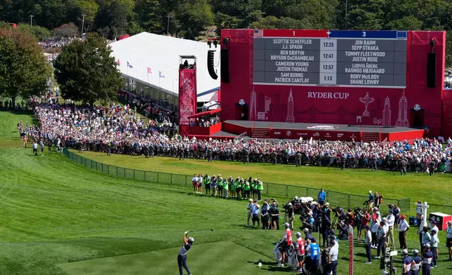 United States' Scottie Scheffler hits his tee shot on the first hole at Bethpage Black golf course during the Ryder Cup golf tournament, Friday, Sept. 26, 2025, in Farmingdale, N.Y. (AP Photo/Seth Wenig)