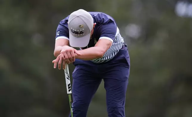 United States' Collin Morikawa reacts after missing a putt on the third hole at Bethpage Black golf course during the Ryder Cup golf tournament, Friday, Sept. 26, 2025, in Farmingdale, N.Y. (AP Photo/Seth Wenig)