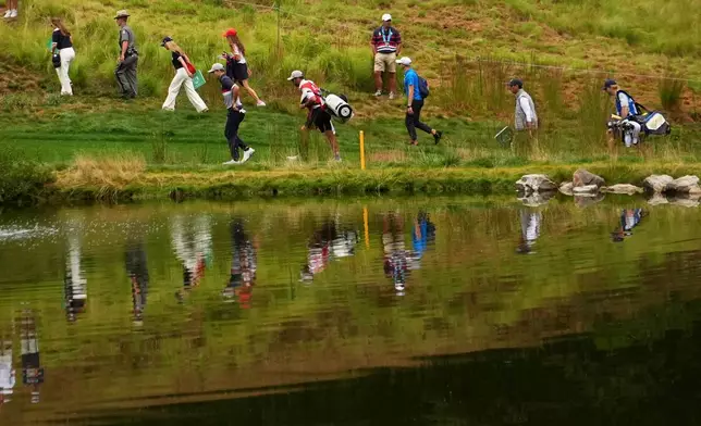 United States' Russell Henley walks on the eighth hole at Bethpage Black golf course during the Ryder Cup golf tournament, Friday, Sept. 26, 2025, in Farmingdale, N.Y. (AP Photo/Lindsey Wasson)