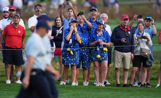 Europe's Rory McIlroy and Tommy Fleetwood walk on the second hole at Bethpage Black golf course during the Ryder Cup golf tournament, Friday, Sept. 26, 2025, in Farmingdale, N.Y. (AP Photo/Seth Wenig)