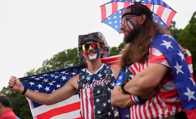 Fans watch on the seventh hole at Bethpage Black golf course during the Ryder Cup golf tournament, Friday, Sept. 26, 2025, in Farmingdale, N.Y. (AP Photo/Lindsey Wasson)