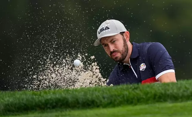 United States' Patrick Cantlay hits from the bunker on the fourth hole at Bethpage Black golf course during the Ryder Cup golf tournament, Friday, Sept. 26, 2025, in Farmingdale, N.Y. (AP Photo/Robert Bukaty)