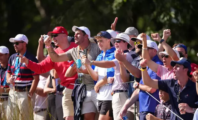Fans cheer on the sixth hole at Bethpage Black golf course during the Ryder Cup golf tournament, Friday, Sept. 26, 2025, in Farmingdale, N.Y. (AP Photo/Lindsey Wasson)