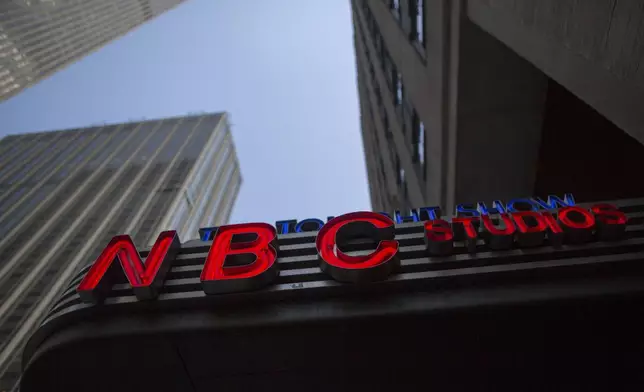 FILE - This May 10, 2017, file photo shows an NBC logo at their television studios at Rockefeller Center in New York. (AP Photo/Mary Altaffer, File)