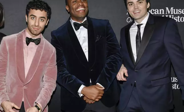 FILE - Emil Wakim, from left, Devon Walker and Michael Longfellow appear at the American Museum of Natural History's Museum Gala in New York on Dec. 5, 2024. (Photo by Evan Agostini/Invision/AP, File)