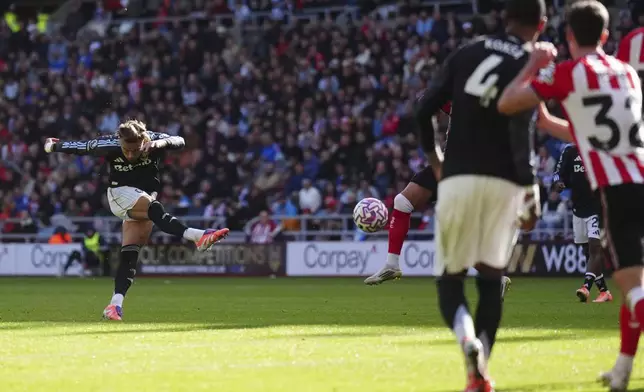 Aston Villa's Matty Cash scores his side's first goal of the game during the English Premier League soccer match between Sunderland and Aston Villa at the Stadium of Light, in Sunderland, England, Sunday Sept. 21, 2025. (Owen Humphreys/PA via AP)
