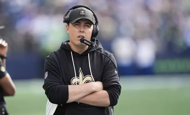 New Orleans Saints head coach Kellen Moore walks on the sideline in the second half of an NFL football game against the Seattle Seahawks, Sunday, Sept. 21, 2025, in Seattle. (AP Photo/Stephen Brashear)
