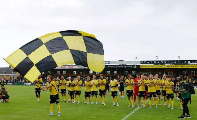Mjallby players celebrates after winning their soccer match against IK Sirius FK at Strandvallen in Hallevik, Sweden, Saturday July 27, 2025. (Andreas Hillergren /TT News Agency via AP)