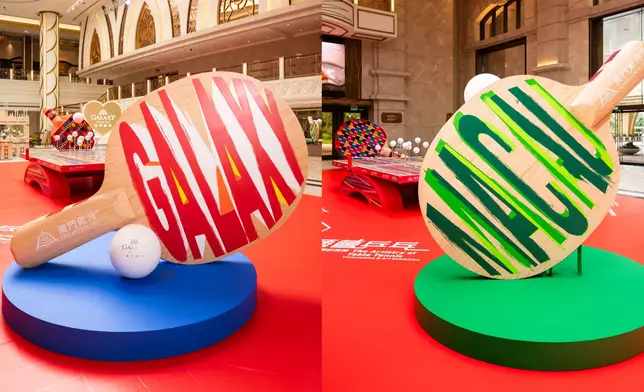 Hand-painted lettering of “Galaxy” and “Macau” Giant Rackets: “The Artistry of Table Tennis – Collectables &amp; Art Exhibition” is a deft exploration of the game’s rich design heritage and aesthetic evolution. At its heart, a large-scale installation of a giant ball and rackets captures the kinetic energy of the game, while a collaborative art piece, set to be unveiled in mid-October, promises another deft touch.