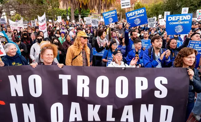 Protesters rally against immigration raids in San Francisco on Thursday, Oct. 23, 2025. (AP Photo/Noah Berger)