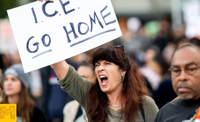 Heather Davison protests against immigration raids in San Francisco on Thursday, Oct. 23, 2025. (AP Photo/Noah Berger)