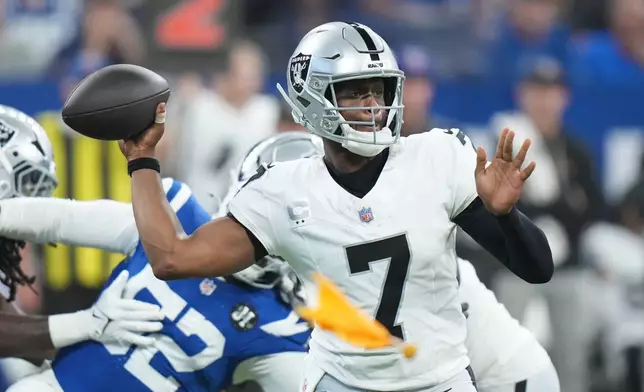 Las Vegas Raiders quarterback Geno Smith throws as a flag is thrown during the second half of an NFL football game against the Indianapolis Colts, Sunday, Oct. 5, 2025, in Indianapolis. (AP Photo/AJ Mast)
