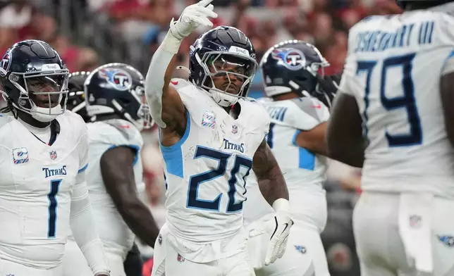 Tennessee Titans running back Tony Pollard (20) celebrates his touchdown during the second half of an NFL football game against the Arizona Cardinals, Sunday, Oct. 5, 2025, in Glendale, Ariz. (AP Photo/Rick Scuteri)