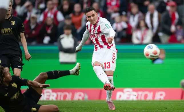 Köln's Said El Mala scores his side's first goal during the German Bundesliga soccer match between 1. FC Köln and Augsburg in Cologne, Germany, Saturday, Oct. 18, 2025. (Marius Becker/dpa via AP)