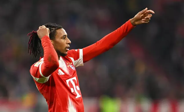 Bayern's Michael Olise during the Bundesliga soccer match between Bayern Munich and Borussia Dortmund in Munich, Germany, Saturday, Oct. 18, 2025. (AP Photo/Lennart Preiss)