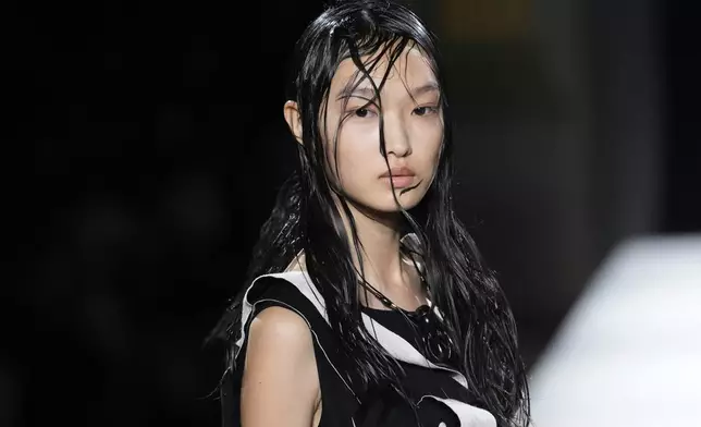 A model wears a creation as part of the Yamamoto Spring/Summer 2026 collection presented in Paris, Friday, Oct. 3, 2025. (AP Photo/Christophe Ena)