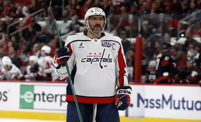 FILE - Washington Capitals' Alex Ovechkin (8) watches the puck against the Carolina Hurricanes during the first period of Game 3 of an NHL hockey Semi-final round playoff series in Raleigh, N.C., May 10, 2025. (AP Photo/Karl DeBlaker, File)