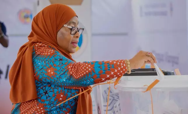 Tanzanian President Samia Suluhu Hassan casts her vote during the general elections at Chamwino polling station in Dodoma, Tanzania, Wednesday, Oct. 29, 2025. (AP Photo)