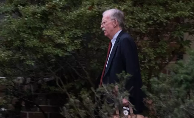 John Bolton, who served as President Donald Trump's national security adviser during his first term, leaves his house in Bethesda Md., Friday, Oct. 17, 2025. (AP Photo/Manuel Balce Ceneta)