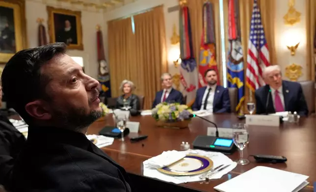 President Donald Trump, right, speaks before a lunch with Ukraine's President Volodymyr Zelenskyy, from left, as White House Chief of Staff Susie Wiles, Treasury Secretary Scott Bessent and Vice President JD Vance listen in the Cabinet Room of the White House, Friday, Oct. 17, 2025, in Washington. (AP Photo/Alex Brandon)