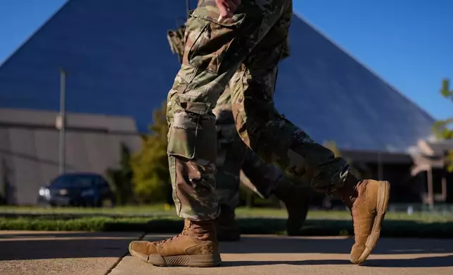 A member of National Guard patrol outside a Bass Pro Shops, Friday, Oct. 10, 2025, in Memphis, Tenn. (AP Photo/George Walker IV)
