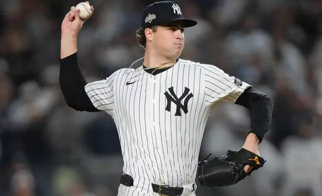 New York Yankees pitcher Cam Schlittler delivers against the Boston Red Sox during the first inning of Game 3 of an American League wild-card baseball playoff series, Thursday, Oct. 2, 2025, in New York. (AP Photo/Yuki Iwamura)