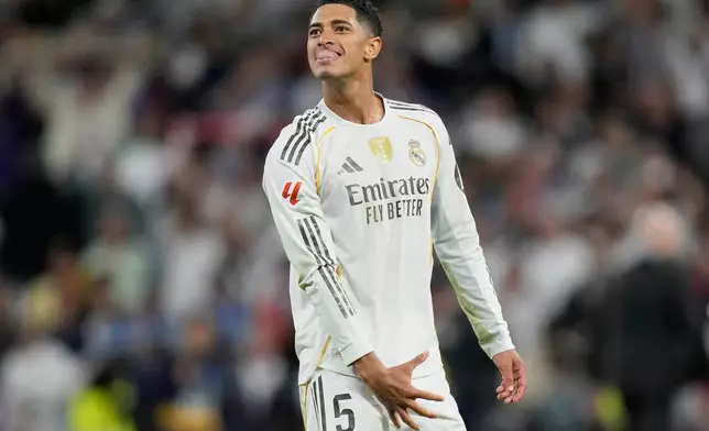 Real Madrid's Jude Bellingham reacts after a La Liga soccer match between Real Madrid and Barcelona in Madrid, Spain, Sunday, Oct. 26, 2025. (AP Photo/Bernat Armangue)