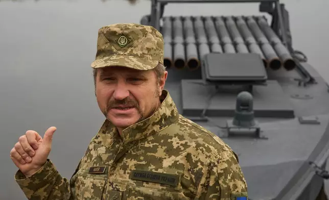Ukraine's Security Service brigade general Ivan Lukashevych answers media questions in front of a Sea Baby drone during a demonstration at an undisclosed location in Ukraine Friday, Oct. 17, 2025. (AP Photo/Efrem Lukatsky)