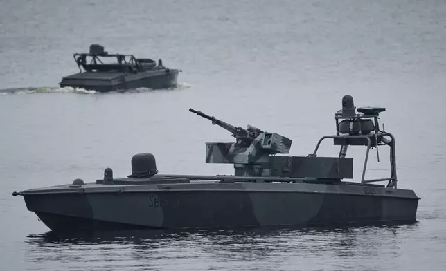 Sea Baby drones ride on the water during a demonstration by Ukraine's Security Service in an undisclosed location in Ukraine Friday, Oct. 17, 2025. (AP Photo/Efrem Lukatsky)