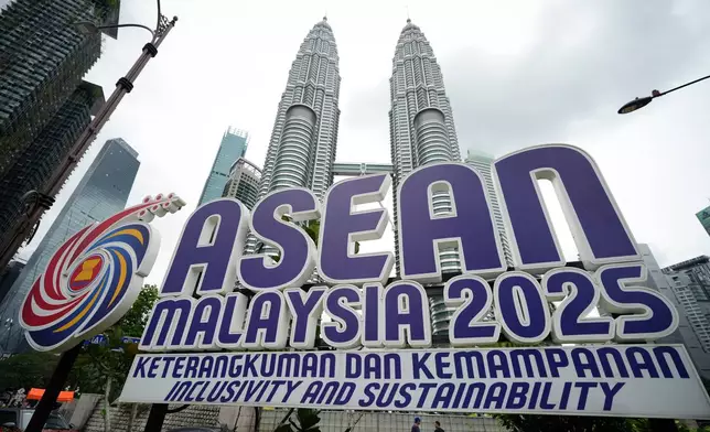 The logo of the Association of Southeast Asian Nations (ASEAN) is pictured in front of Malaysia's Petronas Twin Towers ahead of the 47th ASEAN Summit in Kuala Lumpur, Malaysia, Friday, Oct. 24, 2025. (AP Photo/Vincent Thian)