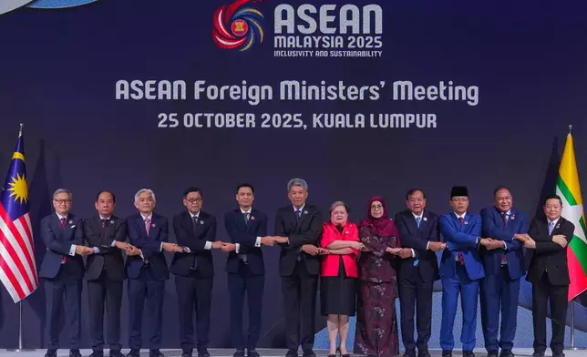 From left to right, Lao's Minister of Foreign Affairs Thongsavanh Phomvihane, Myanmar's Permanent Secretary of the Ministry of Foreign Affairs U Hau Khan Sum, Singapore's Permanent Secretary of Foreign Affairs Albert Chu, Thailand's Foreign Minister Sihasak Phuangketkeow, Vietnam's Deputy Minister of Foreign Affairs Dang Hoang Giang, Malaysia's Foreign Minister Mohamad Hasan, Philippine Foreign Secretary Theresa Lazaro, unidentified Brunei's representative, Cambodia's Foreign Minister Prak Sokhonn, Indonesia's Foreign Minister Sugiono, East Timor's Foreign Minister Bendito dos Santos Freitas and ASEAN Secretary-General Kao Kim Hourn pose for a group photo during ASEAN foreign ministers' meeting at the Kuala Lumpur Convention Centre in Kuala Lumpur, Malaysia, Saturday, Oct. 25, 2025. (AP Photo/Rafiq Maqbool)