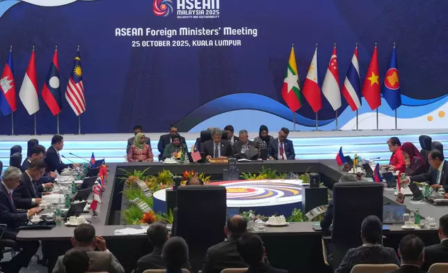 Malaysia's Foreign Minister Mohamad Hasan, center in the background, delivers a speech during the ASEAN foreign ministers' meeting in Kuala Lumpur, Malaysia, Saturday, Oct. 25, 2025. (AP Photo/Rafiq Maqbool)