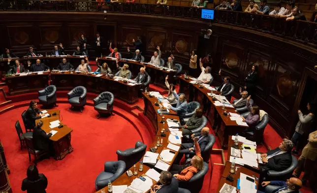 Senators vote in favor of a bill to legalize euthanasia, in Montevideo, Uruguay, Wednesday, Oct. 15, 2025. (AP Photo/Matilde Campodonico)