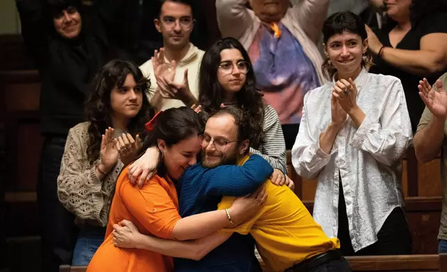 People celebrate after Uruguay's senate passed a law decriminalizing euthanasia, in Montevideo, Uruguay, Wednesday, Oct. 15, 2025. (AP Photo/Matilde Campodonico)